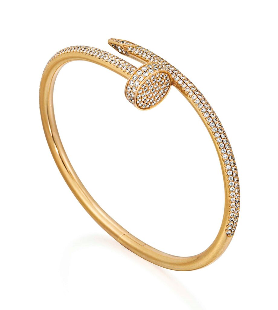 Bracelet Cartier Juste un Clou en or serti de diamants, modèle iconique en forme de clou tordu