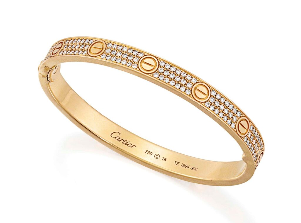 Bracelet Cartier Love en or serti de diamants, modèle iconique aux vis caractéristiques